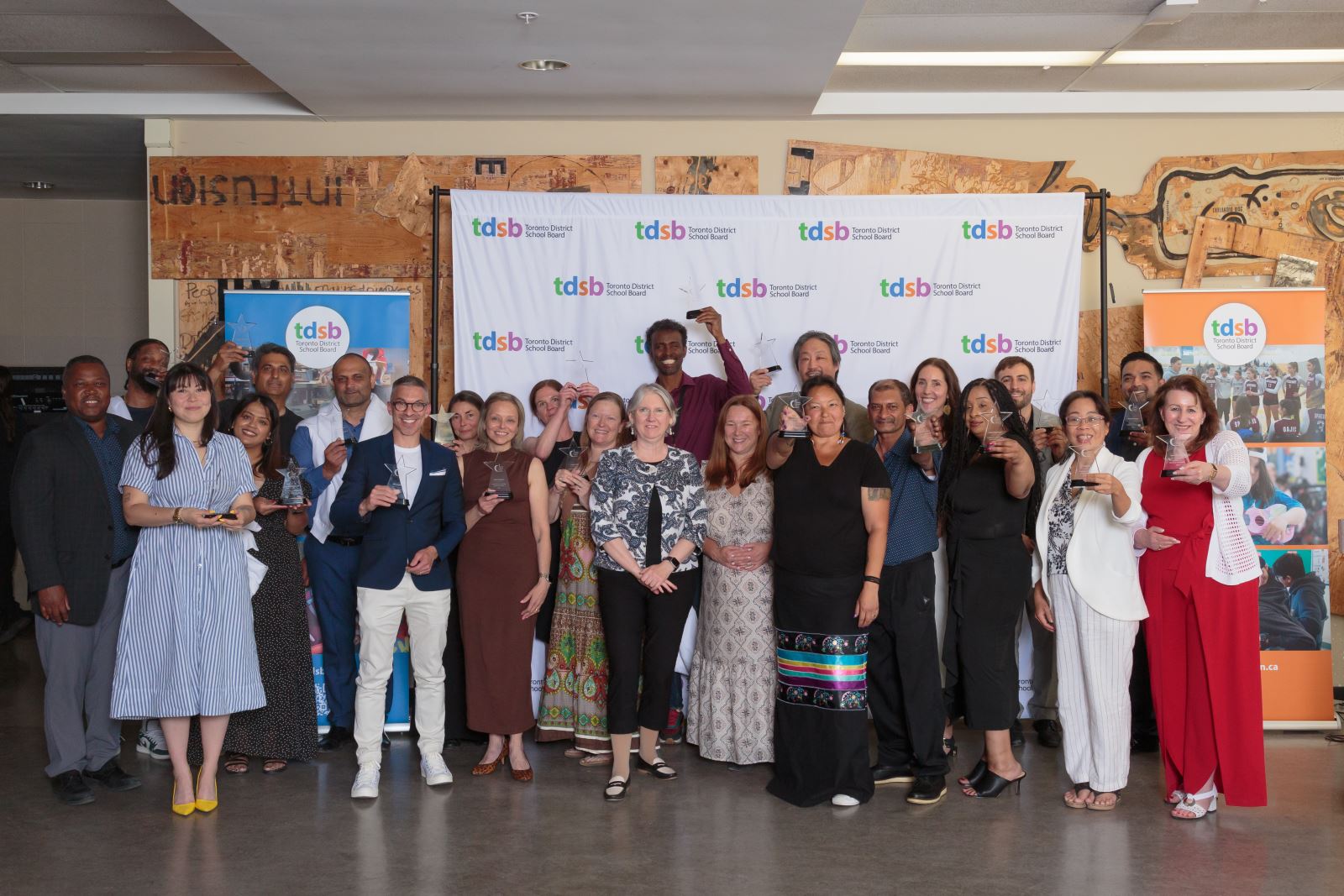 Excellence Awards recipients pose with their trophies for group photo