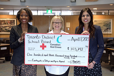 TDSB Chair and Director present The Canadian Red Cross with a cheque $103,792.70 to support relief efforts for those impacted by the earthquakes in Türkiye and Syria.